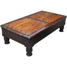 an old style coffee table made from wood and metal, with wooden accents on the top