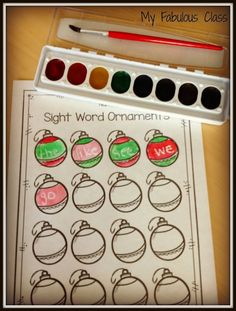 a christmas themed sight word ornament game with markers and crayon pens