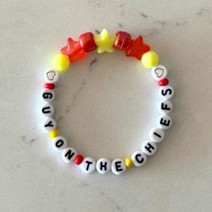 a bracelet that says, you're the cheesy on the side and two gummy bears attached to it