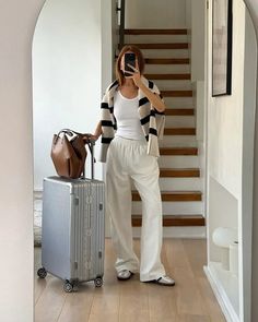 cute airport outfit ideas with a trendy beige sweater with classy thick black stripes layered over a comfortable white lounge set Airport Outfit Classy, Classy Travel Outfit, Classy Airport Outfit, Chic Airport Outfit, Cute Airport Outfit, Chic Travel Outfit, Comfy Airport Outfit, Airport Outfit Summer, Flight Outfit