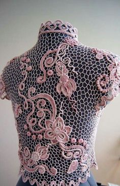 the back of a dress with pink lace on it