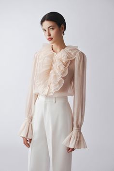 The shirt is the epitome of sophistication and elegance. Crafted from high-quality polyester, each shirt boasts a straight silhouette and poet sleeves for a luxurious touch. Perfect for any occasion, this blouse is a must-have for the fashion-forward individual looking to make a statement. Poet Blouse Outfit, Modest Blouse, Poet Sleeve, Pink Blouse Outfit, Pink Blouses Outfit, Tulle Blouse, Poet Blouse, Winter Blouses, Statement Blouse