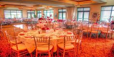 a large banquet room with tables and chairs