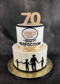 a 50th birthday cake with the number seventy on top and two children holding hands in front