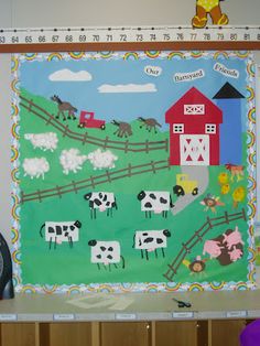 a bulletin board with farm animals on it and a clock in front of the wall