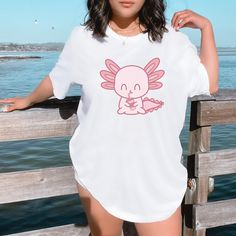 Cute, adorable axolotl tee shirt. 💙Premium quality, eco-friendly t-shirt at an affordable price. Made 100% of the cleanest, most durable and softest form of cotton. You're going to love this t-shirt and our customer service! Our tees are truly one-of-a-kind, so don't miss out on this unbelievable opportunity as they are selling out right now!💙 ✈️SHIPPING AND DELIVERY✈️ The shipping is totally FREE and thanks to our Automated Processing System we can offer you 4-15 day delivery times anywhere i Pet Axolotl, Baby Axolotl, Cute Axolotl, Rare Occasions, Kawaii Animals, Animal Tshirt, Fabric Color, Favorite Outfit, Tee Shirt