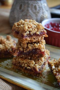 some food is stacked on top of each other with cranberry sauce in the background