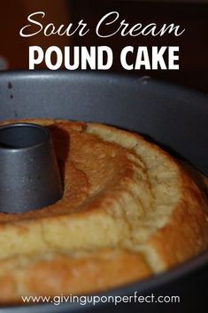 an image of a cake in a pan with the words sour cream pound cake on it