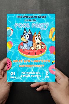 a person holding up a card for a cartoon birthday party with two dogs on an inflatable float