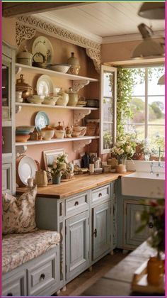 a kitchen filled with lots of counter top space next to a sink and window covered in potted plants