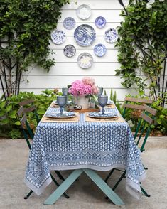 a blue and white table with plates on it