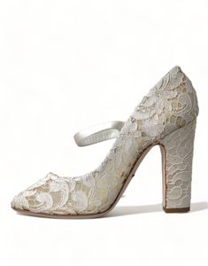 Step into elegance with these exquisite lace sandals by Dolce & Gabbana. Ideal for adding a touch of sophistication to any ensemble, whether it’s a sunny day out or an enchanting evening event. Made in Italy, these Mary Jane Heels sandals blend traditional craftsmanship with modern style, featuring a peep-toe design and comfortable block heels. The delicate beige lace construction in a cream white hue ensures you’ll stand out with every step. Color: Cream white Material: 49% Viscose, 34% Cotton, Elegant Cream Lace-up Sandals With Ankle Strap, Cream High Heel Lace-up Sandals For Spring, Chic Cream High Heel Lace-up Sandals, Cream Lace-up High Heel Sandals With Wrapped Heel, Cream 4-inch Heel Wedding Sandals, Feminine Sandals, High Heel Stiefel, Lace Sandals, Lace Pumps