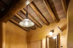 a bathroom with a sink, mirror and lights above the toilet area is shown in this image