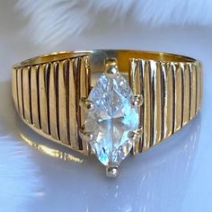 Gorgeous Vintage 10K Yellow Gold Marquise 1 CTW CZ Engagement Ring Size 7.75 A very pretty and unique ring, would make a great gift! * Solid 10k yellow gold with a center 1 CTW CZ Marquise stone. * Size 7.75 * Weighs 4.3 grams Shipped FAST and FREE, fully insured in a gift box! Gold Marquise Cluster Promise Ring, Gold Marquise Topaz Promise Ring, Gold Marquise Cluster Ring For Promise, Anniversary Yellow Gold Marquise Topaz Ring, Classic Marquise Topaz Ring For Gift, Yellow Gold Marquise Cut Collectible Ring, Gold Marquise Brilliant Cut Ring, Gold Marquise Ring With Cubic Zirconia, Gold Marquise Birthstone Ring For Anniversary