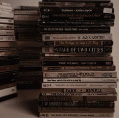 a stack of books sitting on top of a table