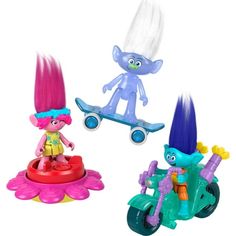 three toy figurines are shown in the same color as they appear to be riding on