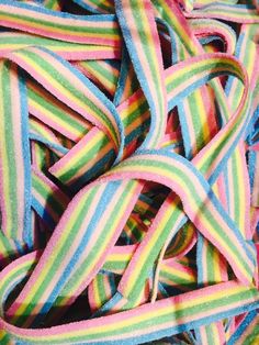 multicolored striped fabric is laying on top of each other