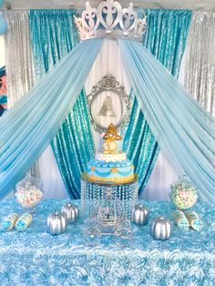 a blue and white table topped with a cake