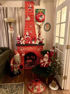 a living room filled with furniture and a fire place covered in santa clause christmas decorations