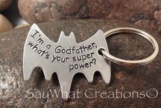 a batman keychain that says i'm a godfatter, is your super power?