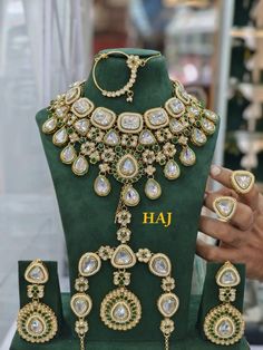 a necklace and earring set on display in a store