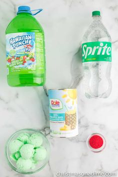 the ingredients to make green jello are displayed on a marble counter top