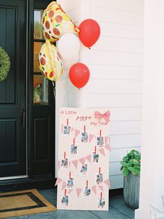 some balloons are hanging on the front door