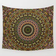 a colorful wall hanging tapestry with an abstract design