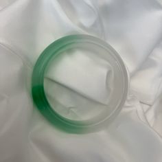 // 54.7mm Natural Jade Bangle - New/Unworn Inner Diameter: 54.7mm Width: 14.4mm Thickness: 8.7mm Weight: 51.6g Please Note: Manual Measurements Using A Caliper, Please Allow +\- 0.5mm In Sizes. Different Screens Might Show Color Differences. Green Classic Bangle For Formal Occasions, Classic Green Round Bangle, Classic Green Bangle Bracelet, Affordable Jade Bangle Jewelry, Adjustable Jade Bangle Bracelets, Jade Bracelet Bangles Chinese, Carved Green Jade Bangle, Hand-strung Green Jade Bracelets, Jade Bangle