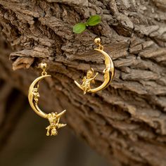 "Introducing our stunning drop earrings! The earring showcases a beautiful crescent moon shape with an angel and a devil sitting on each side, adding a touch of whimsy and charm to any outfit. What makes these earrings truly special is the friendly and playful interaction between the characters. Both the angel 👼and devil👿 are waving their hands in greeting as if to say \"Hi\" to everyone around you. Crafted from high-quality materials, these earrings are both durable and lightweight, making th Whimsical Earrings, Masculine Jewelry, Celestial Earrings, Whimsical Jewelry, Crescent Moon Earrings, Moon Shape, Mismatched Earrings, Angel And Devil, Jewelry Boho