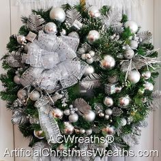 a christmas wreath with silver and silver ornaments