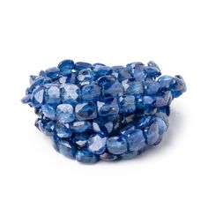 Blue Kyanite faceted pillow beads are highly brilliant with a vitreous luster. These Kyanite beads have a good polish on the symmetrical shape exhibiting a silvery sheen within the transparent gems. These blue Kyanite beads are well matched for their deep color and quality with slight internal characteristics. These Kyanite gems are a deep indigo blue throughout the strand. AA Quality Blue Faceted Beads For Jewelry Making, Blue Kyanite Gemstone Beads Jewelry, Unique Polished Blue Beads, Blue Faceted Round Bead Gemstones, Blue Faceted Gemstones Round Beads, Blue Faceted Glass Beads, Luxury Artisan Blue Beads, Gems And Cabochons, Blue Multi-strand Faceted Beads, Blue Kyanite