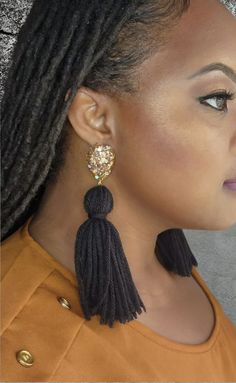 Elevate your style with our beautiful Black and Gold Yarn Tassel Earrings! Perfect for everyday wear or dressing up, these earrings are a nod to the New Orleans Saints - Who Dat! Bold and eye-catching, each earring weighs just 0.3 oz, making them lightweight and comfortable. Crafted with hypoallergenic pushbacks and hooks, they ensure a secure fit for sensitive ears. Make a statement with these stunning earrings! Party Plug Drop Earrings With Latkans, Party Drop Plug Earrings With Latkans, Party Drop Earrings With Latkans, Evening Tassel Chandelier Drop Earrings, Tassel Drop Earrings For Evening, Party Tassel Drop Earrings With Latkans, Tassel Chandelier Drop Earrings For Parties, Party Latkan Tassel Drop Earrings, Tasseled Chandelier Drop Earrings For Party