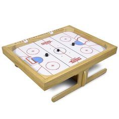 an ice hockey game set up on a wooden stand