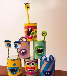 several tin can monsters are stacked on top of each other