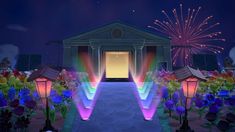 the entrance to a building is lit up at night with colorful lights and flowers around it