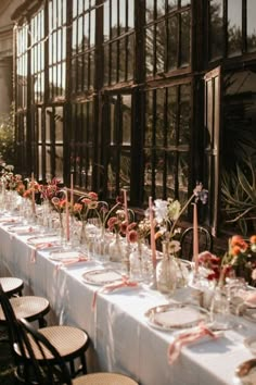 a long table is set up outside for an event