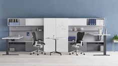 an office with two desks and chairs in front of a bookcase on the wall