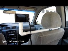 the interior of a car with an electronic device attached to the dash board