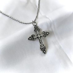 This silver Gothic cross necklace features a vintage grunge design, making it an ideal gift for her, especially for women who appreciate religious jewelry, Catholic gifts, or cross charm necklaces. 𝐃𝐄𝐓𝐀𝐈𝐋𝐒:  ⭐️ Necklace lengths available 14" 16" 18" 20" ⭐️ Silver Cross Pendant size is 2" ⭐️ The silver cross charm is silver plated over alloy. The chain necklace is made up of high qualitystainless steel, safe for those with sensitive skin ⭐️ The best statement necklace, The Silver Celestial Gothic Cross Necklace, Cross Charm Necklace, Grunge Jewelry, Gothic Cross, Gothic Crosses, Silver Cross Pendant, Grunge Vintage, Catholic Gifts, Vintage Grunge