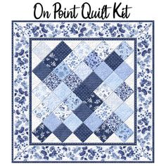 a blue and white quilt with the words on point quilt kit