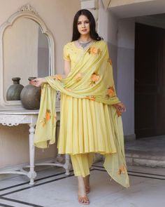 This is a beautiful 3 piece anarkali suit set.The set includes anarkali style kurta has round neck, short sleeves & calf length.It also comes with solid pants with semi elasticated waistband and a hand painted dupatta with and tassels and lace detailing. Suit Fabric-Mul Cotton Dupatta Fabric-Chiffon Length-Calf Length Color - Yellow Neck-Round Neck Sleeves-3/4th sleeves Washing Care-Dry Clean or Quick Deep Wash DISCLAIMER - The color of the product may be differ due to screen settings of device. Suit Poses, Painted Dupatta, Brush Paint, Cotton Dupatta, Anarkali Suit, Suit Fabric, Suit Set, Salwar Kameez, Anarkali