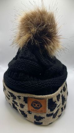 Fun and stylish beanie with pom-pom and accented with leopard print! Casual Fall Beanie With Pom Poms, Beanie With Pom Pom, Beanie With Pom, Black Beanie, Pom Beanie, How To Feel Beautiful, Boutique Clothing, Apparel Accessories, Leopard Print