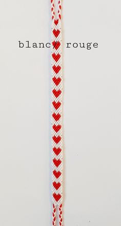 a red and white bracelet with hearts on it that says blancc rouee