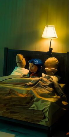 a doll is laying in bed next to a lamp