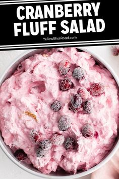 a bowl filled with cranberry fluff salad