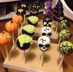 halloween cupcakes on sticks decorated with icing and sprinkles