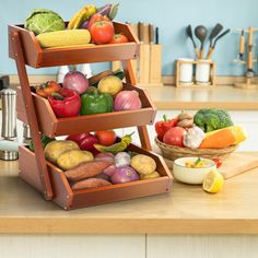 three tiered wooden fruit and vegetable stand on a kitchen counter