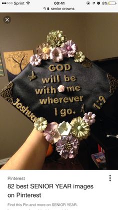 someone is holding up a graduation cap that says god will be with me wherever i go