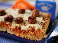 meatballs and cheese pizza on a blue plate